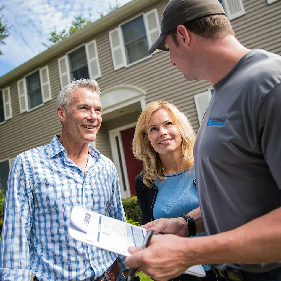 Technician speaking with homeowners