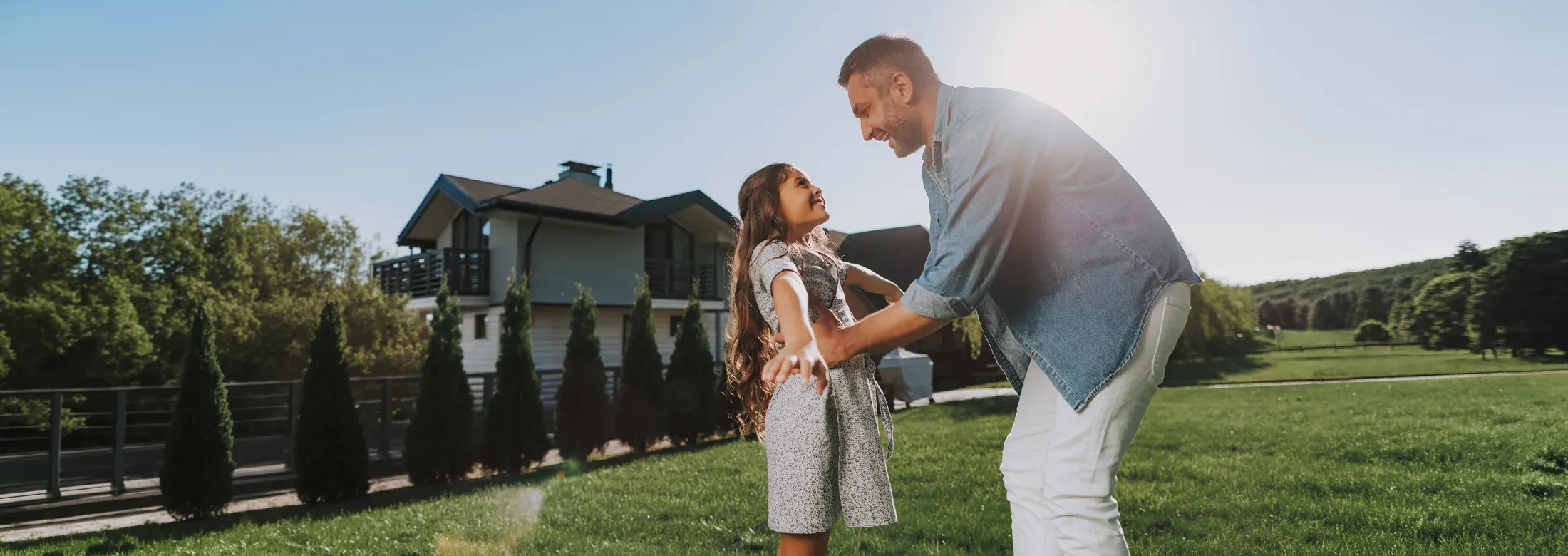 father and daughter playing outside